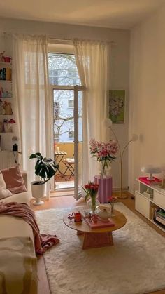 a living room filled with furniture and flowers