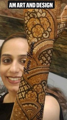 a woman holding up her hand with henna on it and the caption says, i am art and design