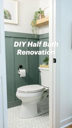 a white toilet sitting inside of a bathroom next to a wooden floor and green walls