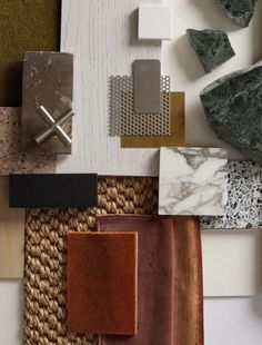 various materials are arranged on top of each other, including tiles and rugs in different colors