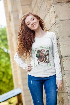 This Irish You A Merry Christmas Tee Shirt features Santa wearing green and four leaf clover accents, perfect for adding a touch of holiday spirit to your wardrobe. The unisex design makes it suitable for both men and women, making it a great gift for anyone looking to celebrate the festive season. Product features - Unisex Jersey Long Sleeve Tee - With side seams for structural support - Ribbed knit collar for shape retention - Shoulder tape for stability - Variety of fiber compositions for dif Green Long Sleeve Holiday Top, Green Long Sleeve T-shirt For Holiday, St. Patrick's Day Cotton Crew Neck Tops, Casual Green Holiday Tops, Casual Green Top For Holiday, Cotton Crew Neck Top For St. Patrick's Day, Holiday Long Sleeve Cotton Top, Cotton Long Sleeve Holiday Top, Long Sleeve Cotton Top For Holiday