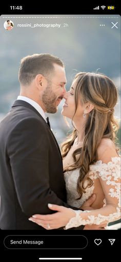 a bride and groom kissing in front of the camera