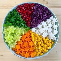 a bowl filled with lots of different types of candy stars and star shaped candies