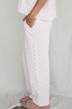 Pink heart pajama pants with elasticated Sunkissed Coconut waistband and side pockets Material is Polyester Tumble dry low Model is 5'6 wearing a small SHOP THE LOOK Small Medium Large X-Large Length 36.5" 37.5" 38.5" 39.5" Waist 13" 14" 15" 16" Sunkissed Coconut, Wedding Guest Romper, Better Everyday, Party Bottoms, Cozy At Home, Pj Pants, Denim Romper, Maxi Dress Party, Romper Dress