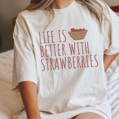 This strawberry tshirt makes a totally unique strawberry gift for strawberry pickers, gardeners, and just any strawberry lover in your life! This strawberry crewneck is the perfect cottage core aesthetic fruit shirt for spring, summer, and more! Grab this tee today while it's on sale! Delivery Times: ◦ Production: 1 business day on average (maximum: 5) ◦ Shipping: 2 business days on average (maximum: 5) Unisex Fit: ◦ Extra soft, preshrunk unisex t-shirt ◦ Women: Semi-fitted, laidback, rollable, & tuckable ◦ Men: Fitted on upper body & loose around the belly ☞ Size up for a looser fit Soft Materials: ◦ Super soft, preshrunk tee with eco-friendly materials ◦ Black, White, & Navy: 100% soft ring spun cotton ◦ Heather Navy: 65% polyester & 35% cotton ◦ Sport Grey: 90% cotton & 10% polyester Strawberry Tshirt, Strawberry Clothing, Aesthetic Fruit, Funny Science Shirts, Strawberry Aesthetic, Lesbian Shirts, Strawberry Gifts, Fruit Shirt, Strawberry Shirt