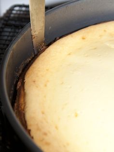 a pan that has some kind of food inside of it with a knife sticking out of it