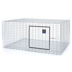 a large white metal cage with a door on the front and side, which has a black square opening at the top