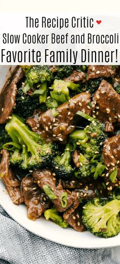 broccoli and beef stir fry in a white bowl with sesame seeds on top