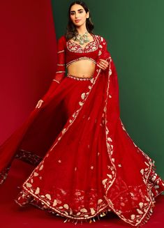 Features a deep red organza lehenga with floral motifs on the border and waistline. Teamed with a sweetheart neckline blouse with scallop lace trim and fringed hem. This full sleeved blouse has a cutout back with tie ups and tassel detailing. Complete this look with tassels and bordered embellished dupatta. Composition : Lehenga & Dupatta: Organza, Blouse: Raw Silk & Georgette,Lining: Shantoon Care: Dry Clean Only and Vacuum Storage All products can be customised for sleeves, length of blouse an Marodi Embroidery, Marodi Work, Punit Balana, Baju Kahwin, Lehenga Style Saree, Indian Bridesmaid Dresses, Lehenga Dupatta, Organza Lehenga, Lehenga Designs Simple