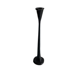 a tall black vase sitting on top of a table