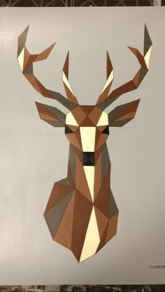 a deer head made out of geometric paper