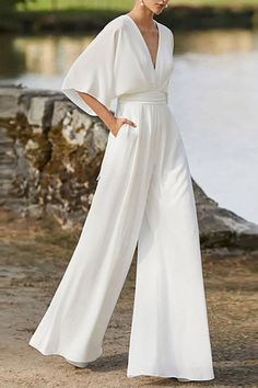 Details:			Material: Polyester				Style: Elegant				Pattern Type: Solid				Element: Solid Color				Neckline: V Neck				Sleeve Style: Regular Sleeve				Sleeve Length: Half Sleeve				Fit Type: Boot Cut				Profile: Wide Leg				Type: Solid Color				Size(in)			Bust			Waist			Length			Hips			Sleeve Length				S		31.5			25.2			55.5			34.6			13.8					M		33.1			26.8			56.3			36.2			13.8					L		34.6			28.3			57.1			37.8			14.2					XL		36.2			29.9			57.9			39.4			14.2					2XL		37.8			31.5			58.7			40.9			14 Backless Jumpsuit, Elegante Casual, Elegant Pattern, White Jumpsuit, Elegant Party, Black White Pink, Aaliyah, Spring Outfits Casual, Casual Summer Outfits