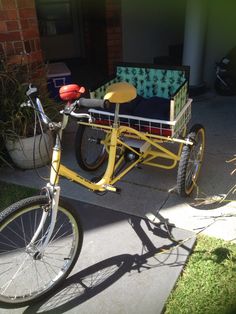 a yellow bike with a basket attached to it