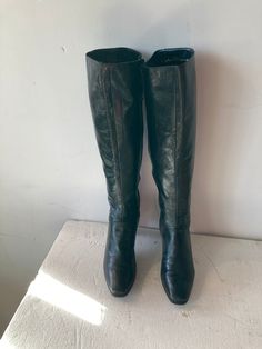 Sz 7.5 Length: 10.5" Width:3" Height: 18'' Calf width: 17.5"Insole: 9" Heel height 2.5" greed has never looked so good vintage fashion 1990s FERRAGAMO boots black leather low heel boots knee high  side zip a swirl top stitch design on the ankle High fashion leather lining and sole Made in ITALY Good condition Retro Wide Calf Knee-high Boots, Vintage Knee-high Heeled Boots For Winter, Vintage Black Knee-high Boots For Fall, Vintage Heeled Boots With Square Toe For Winter, Vintage Square Toe Heeled Boots For Winter, Retro Knee-high Leather Boots, Vintage Wide Calf Knee-high Boots For Fall, Vintage Wide Calf Leather Mid-calf Boots, Vintage Mid-calf Leather Boots