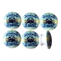 four blue crab shack buttons with the words crab shack written on them and an image of a crab