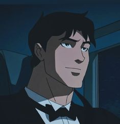 an animated image of a man in a tuxedo and bow tie looking at the camera