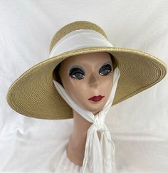 This tan 4 inch down turn brim Toyo straw hat is very durable and keeps the shape, great for travel. The hat has a removable white chiffon blend fabric band and under chin tie. The hat will fit up to 22 7/8 inch head size with an inside sizing cord to adjust to your head size. You can easily remove the tie and use another ribbon or scarf to match your outfit. NOTE: Please check the head size before purchase, I am happy to answer any questions you may have. There will be a 20% restocking fee for Sun Hat With Chin Strap, White Straw Hat For Outdoor Vacation, Adjustable White Hats For Warm Weather, Cream Straw Hat With Short Brim For Outdoor, Cream Straw Hat With Curved Brim For Outdoors, Cream Brimmed Straw Hat For Outdoor, Outdoor Cream Straw Hat With Curved Brim, White Sun Hat For Travel And Kentucky Derby, White Bucket Straw Hat For Warm Weather