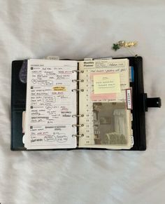 an open planner book with notes on it