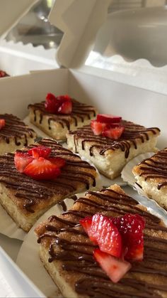 there are many desserts on the tray ready to be eaten