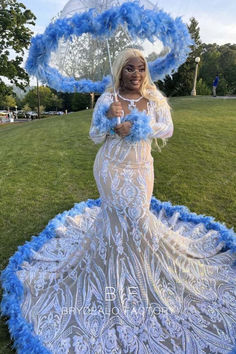 Made from sparkling graphic ivory sequin fabric, this stunning Blue Feathered Long Train Mermaid Iridescent Sequin Prom Dress features illusion neck, long sleeves with feathered cuffs, trumpet skirt with long train. A nice piece for your next formal event. Prom 2k23, Prom Fits, Prom Attire, Sequins Prom Dress, Prom Fashion, Prom Pics, Prom Dress With Train