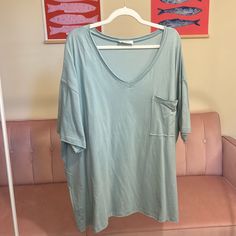 Oversized Boyfriend Tee With Front Pocket And Raw Edge! This Is Such A Fun Minty Green Color! Material: 100% Cotton Mega Oversized!! Small: Medium: Ptp 30” Length 30” Large: Ptp 31” Length 30” Extra Large: Ptp: 32” Length 31” 1x: Ptp 33.5” Length 32” 2x: Ptp 33” Length 32” 3x: Ptp 34” Length 32” Oversized Casual Short Sleeve Top For Loungewear, Casual Oversized Short Sleeve Top For Loungewear, Casual V-neck Short Sleeve Top For Loungewear, Green Relaxed T-shirt For Loungewear, Oversized V-neck T-shirt For Spring, Oversized Soft-washed Tops For Day Out, Relaxed Soft-washed Short Sleeve Tops, Oversized Short Sleeve Tops For Loungewear, Oversized Short Sleeve Top For Summer