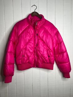 Stay chic and cozy in this Rue Woven Padded Jacket in Pink! This fashionable fuchsia-colored piece is sure to keep you warm and stylish. Keep the chill away and make a fashion statement in this comfy-cute vest. Perfect for every outdoor adventure! Pink Winter Puffer Jacket With Pockets, Pink Puffer Jacket With Pockets For Winter, Pink Nylon Puffer Outerwear, Pink Puffer Winter Outerwear, Pink Quilted Puffer Jacket For Cold Weather, Pink Nylon Winter Outerwear, Pink Quilted Puffer Jacket For Winter, Pink Winter Puffer Outerwear, Winter Nylon Pink Outerwear