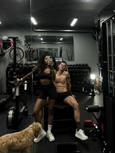 a man and woman are sitting in the gym