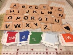 several pieces of wood cut out to spell letters