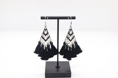 The Silver and Black Tassel Earrings showcase a striking contrast with their silver base and stylish black tassels, creating a chic and contemporary look. These earrings effortlessly blend sophistication with a touch of edge, making them a versatile accessory to elevate your fashion ensemble. Black Fringe Tassel Drop Earrings, Black Fringe Drop Earrings, Trendy Black Fringe Jewelry, Black Fringe Dangle Earrings, Black Fringe Earrings For Party, Party Black Fringe Earrings, Elegant Black Tassel Drop Earrings, Black Tassel Earrings For Party, Black Tassel Drop Earrings For Evening