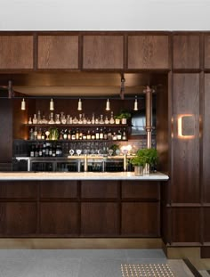 a bar with lots of bottles on the shelves