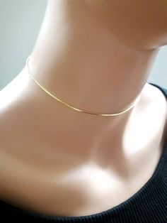 "Handmade by Eriko Design Studio in Brooklyn, NY Delicate gold snake chain choker necklace- basic yet stylish: it can be layered with other chokers or necklaces. -------------------- DETAILS ・1 mm 24K gold plated snake chain ------------------- SIZE ・Available in 4 sizes 12\"- 14\" ( 12 inches + adjustable 2 inch extender) 14\" -16 \"( 14 inches + adjustable 2 inch extender) 16\"- 18\"( 16 inches + adjustable 2 inch extender) 18\"-20\"(18 inches + adjustable 2 inch extender) ・It closes with lobs Unique Choker Necklaces, Choker Necklace Gold, Dainty Chain Necklace, Gold Snake Chain, Bad Bad, Gold Chain Choker, Dainty Chain, Necklace Simple, Gold Choker Necklace