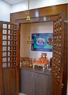 an open door leading into a room with jewelry on the table and decorations hanging from it