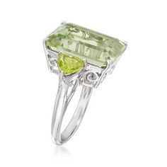 Ross-Simons - 11.00ct Emerald-Cut Prasiolite, 1.40ct t. w. Peridot Ring Size 5. An impressive 11.00 carat emerald-cut prasiolite pops on the finger, enhanced by 1.40 ct. t. w. trillion-cut peridots at each side of the polished sterling silver shank. A lush, verdant cocktail ring for so many fabulous moments. 5/8" wide. Peridot and prasiolite ring. Peridot birthstones are the perfect gift for August birthdays. Green Multi-stone Topaz Ring For Formal Occasions, Formal Green Multi-stone Topaz Ring, Fine Jewelry Peridot Gemstones For Formal Occasions, Formal Peridot Ring With Accent Stones, Green Birthstone Ring With Gemstone Accents For Formal Occasions, Formal Green Amethyst Ring With Accent Stones, Formal Lime Green Rings With Center Stone, Formal Green Amethyst Ring With Gemstone Accents, Formal Lime Green Peridot Rings