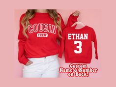 "Custom Cousin Crew Long Sleeve T-shirts and Sweatshirts. Personalized Name and Number on the backside. Available in a wide range of sizes for kids of all ages! Get your Cousin Crew ready for your next Party or Family outing with these Matching Shirts!  \"Cousin Crew\" design on the front. *Sweatshirts and Long Sleeve T-shirts are sold individually so you can personalize each item with a different name* (For 3 shirts, add 3 items to your cart) ♡ HOW TO ORDER: 1. Select Size and Shirt Style using Red Long Sleeve Sweatshirt For School, Red School Spirit Tops For School, Family Matching Red Tops With Letter Print, Red Winter Top For School, Red School Spirit Top With Name Print, Red Tops With Name Print For School Spirit, Red Top With Name Print For School Spirit, Red Crew Neck Top For School, Red Fall Tops For School