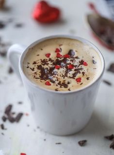 a white cup filled with chocolate and cream