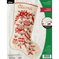 an embroidered christmas stocking with owls on it