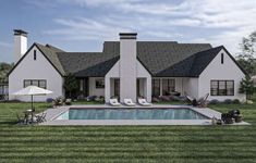 a large white house with a pool in the front yard