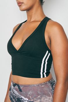 S Athleisure Tops With Built-in Bra For Relaxation, Black Tank Top For Yoga With Bust Support, Black Tank Top With Bust Support For Yoga, Black Tank Top With Medium Bust Support For Yoga, Black V-neck Sports Bra, Black Tank Top For Summer Pilates, Black Summer Tank Top For Pilates, Sporty Top With Built-in Bra For Yoga, Sporty V-neck Yoga Tops