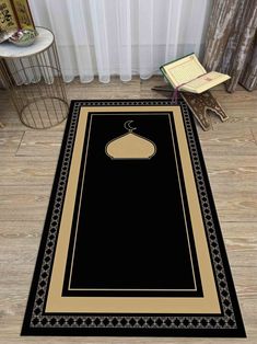 a black rug with a gold border on the floor