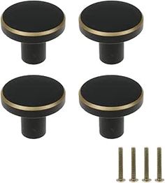 four black and gold knobs with screws