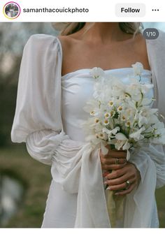 a woman wearing a white dress holding a bouquet of flowers in her left hand and an instagram on the right