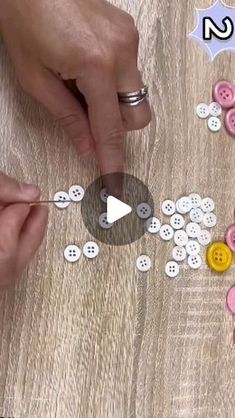 two hands are making buttons on a wooden surface with the words no in front of them