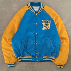 Men's Vintage 1982 Oakland Invaders Satin Bomber Jacket  + Damage: Minor Marks To Sleeves  + Tag: Swingster  + Made In USA  + Outer Material: Nylon / Lining Material: Polyester  + Colour: Blue  + Size Label States: Medium  + Recommended Size: Medium  + Measurements (Inches): Pit To Pit = 23, Body Length = 24  Please note that all vintage items have been previously worn, and may show some signs of previous wear. However, any significant damage will be photographed and/or stated in the items listi Size Label, Medium Blue, Vintage Men, Mens Jackets, Bomber Jacket, Vintage Items, Jackets & Coats, Satin, Mens Outfits