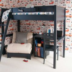 a bunk bed with a desk underneath it and a chair in the corner next to it