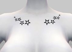 the back of a woman's body with stars on her left shoulder and right breast