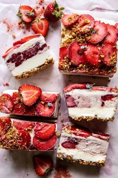 three pies with berries and whipped cream on top are sitting on a baking sheet