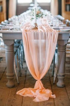 an image of a table set with place settings and napkins on it for a wedding reception