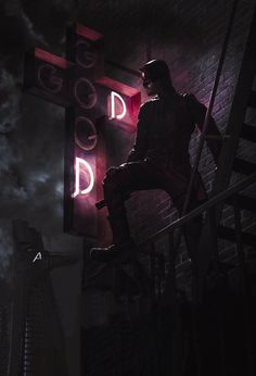 a man sitting on top of a stair case next to a sign that reads good god