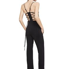 Bcbgmaxazria Esmee Lace-Up Jumpsuit Halter Never Worn. This Jumpsuit Is 88% Poly , 12% Spandex And The Lining Is 100% Poly. This Stunning Garment Features Adjustable Shoulder Straps, Side-Seam Pockets, Lace-Up Back Panels With Tie Closure, Hidden Back Zipper Closure, Body Measures Approximately 32" In Length At Longest Adjustment. Because Straps Are Adjustable, Length May Vary. Fitted Elastane Pantsuit For Party, Fitted Backless Jumpsuit For Workwear, Fitted Elastane Pantsuit For Night Out, Fitted Overall Pantsuit For Date Night, Chic Evening Elastane Pantsuit, Chic Elastane Pantsuit For Party, Sleeveless Fitted Pantsuit For Going Out, Fitted Elastane Jumpsuits And Rompers For Evening, Shoulder Straps