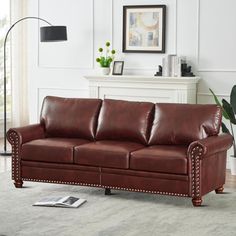 a living room with a brown leather couch